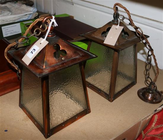 Pair of Libertys Arts & Crafts copper lanterns, pierced with trefoils and studded (rewired by W. Sitch & Co Ltd)